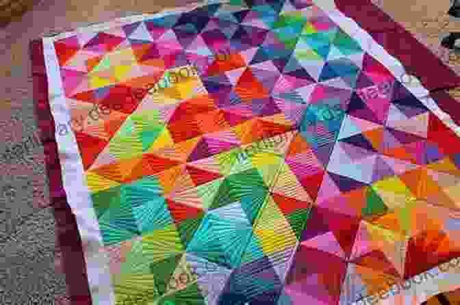 A Rainbow Quilt With A Triangle Pattern Modern Rainbow Patchwork Quilts: 14 Vibrant Rainbow Patchwork Quilt Projects Plus Handy Techniques Tips And Tricks (Crafts)