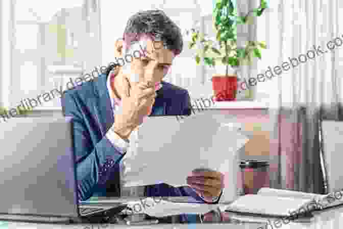 A Sales Professional Reviewing A Document While Sitting At A Desk In A Modern Office Setting SOS BUSINESS SALES: Improve Your Technique By Adopting A Solid Set Of Sales Fundamentals