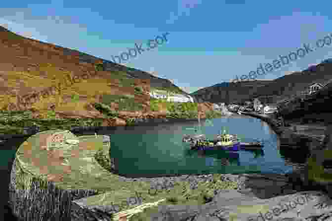 View Of Boscastle Harbor, Showcasing Colorful Fishing Boats Moored In The Tranquil Waters, With Steep Cliffs And Waterfalls In The Background A Leisurely Guide To The South West Coast Path: Port Isaac To St Ives